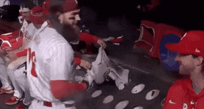 Baseball Players Sitting In Dugout GIF