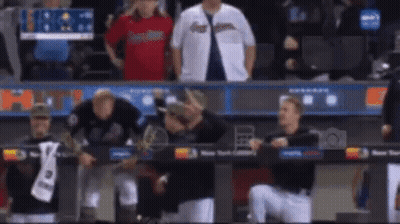 Baseball Players Standing In Dugout GIF
