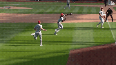 Baseball Players Standing On Field GIF