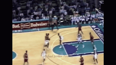 Basketball Game In Front Of Budweiser Ad GIF