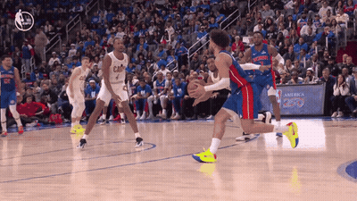 Basketball Game In Front Of Crowd With America 250 Sign GIF