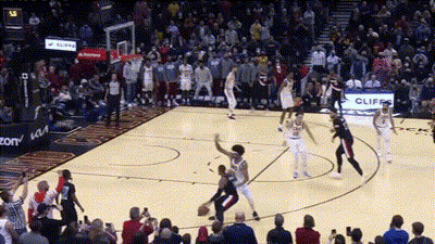 Basketball Game In Front Of Crowd With Cliff Sign GIF