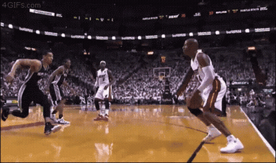 Basketball Game In Front Of Crowd With Heat Sign GIF