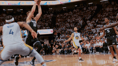 Basketball Game In Front Of Crowd With Netflix Logo GIF