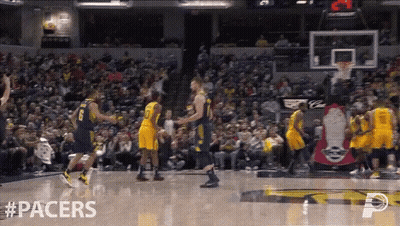 Basketball Game In Front Of Crowd With Pacers On Floor GIF