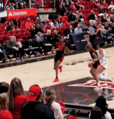 Basketball Game In Front Of Crowd With State Farm Sign GIF