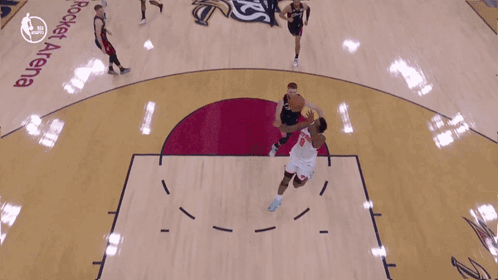 Basketball Game in Front of Emirates Banner