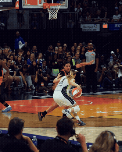 Basketball Game In Front Of Hartford Health Care Sign GIF