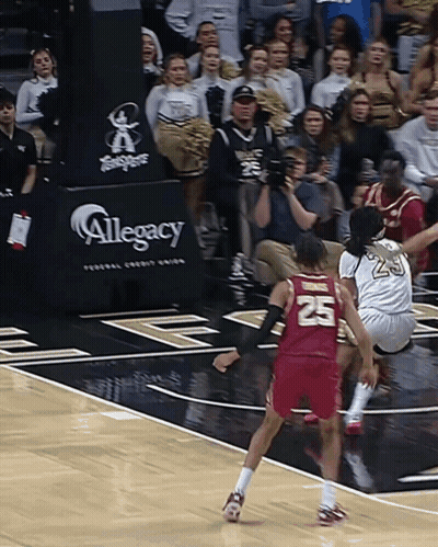 Basketball Game In Front Of Legacy Banner GIF