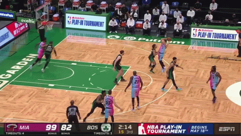 Basketball Game In Front Of NBA Play-In Tournament Screen GIF