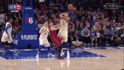 Basketball Game In Front Of Playoffs Banner GIF