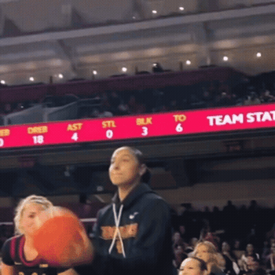Basketball Game In Front Of Team Stat Board GIF