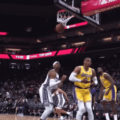 Basketball Game In Front Of Toyota Tip Off Sign GIF