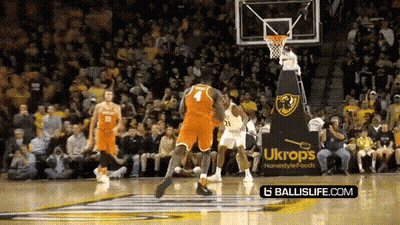 Basketball Game In Front Of Ukrops Ad GIF