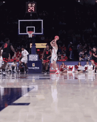 Basketball Game In Front Of Vintage West Sign GIF