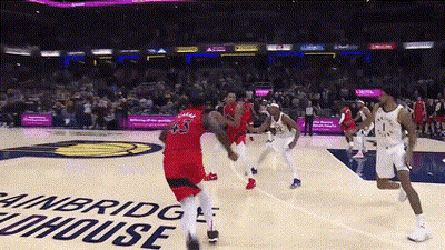 Basketball Game In Front Of Winbridge Funhouse Sign GIF