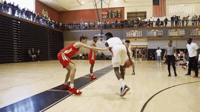 Basketball Game In Gym With Marsheel On Wall GIF