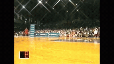 Basketball Game In Stadium With Scoreboard Showing 8 GIF