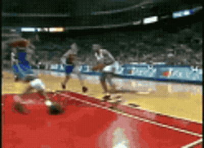 Basketball Game In Stadium With Sideline Ads GIF