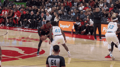 Basketball Game On Court With Tangerine Sign GIF