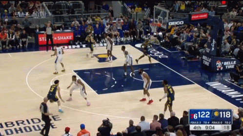 Basketball Game With Geico Sign In Crowd