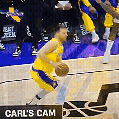 Basketball Player Dribbling in Front of Carl's Cam Sign