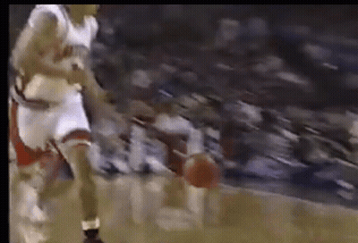 Basketball Player Dribbling In Front Of Crowd GIF