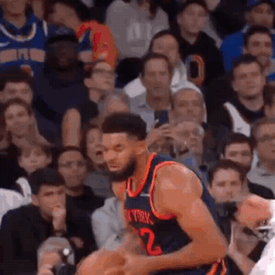 Basketball Player Dribbling In Front Of Crowd GIF