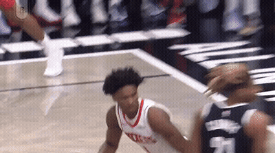 Basketball Player Dribbling Past Defender GIF