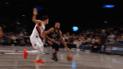 Basketball Player Dribbling While Another Watches GIF