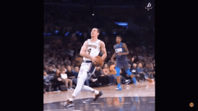 Basketball Player Dribbling While Another Watches GIF