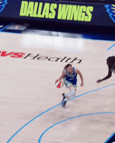 Basketball Player Dribbling With Dallas Wings Sign GIF