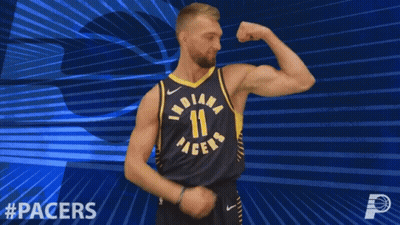 Basketball Player Flexing In Front Of Pacers Logo GIF