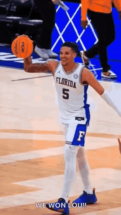Basketball Player Holding Basketball Smiling GIF