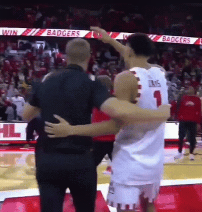 Basketball Player Hugging Another Player On Court GIF