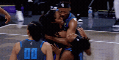 Basketball Player In 00 Jersey Hugged By Teammates GIF