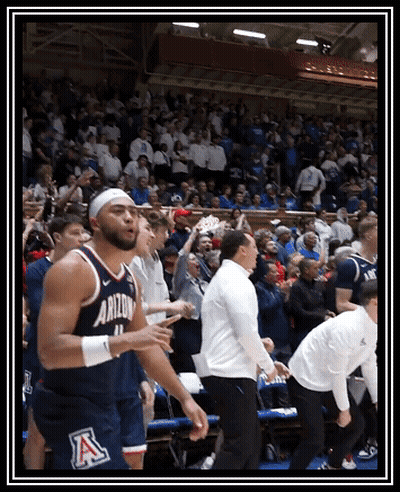 Basketball Player In Arizona Jersey Surrounded By Fans GIF
