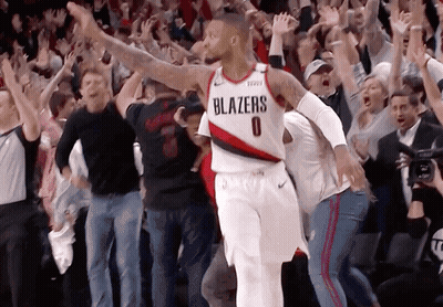 Basketball Player In Blazers Jersey Surrounded By Fans GIF