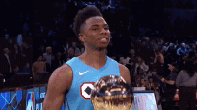 Basketball Player In Blue Jersey Holding Trophy GIF