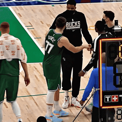 Basketball Player In Bucks Jersey Shaking Hands With Referee GIF