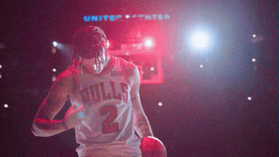 Basketball Player In Bulls Jersey Holding Basketball GIF