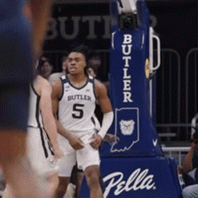 Basketball Player In Butler Jersey In Front Of Pella Hoop GIF