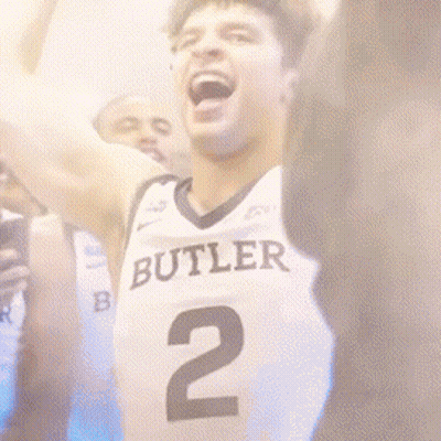 Basketball Player In Butler Jersey Number 2 Raising Arms GIF