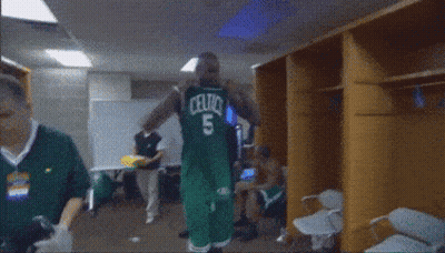 Basketball Player In Celtics Uniform Dancing In Locker Room GIF