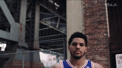 Basketball Player In Front Of Brick Building GIF