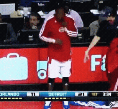 Basketball Player In Front Of Detroit Sign GIF