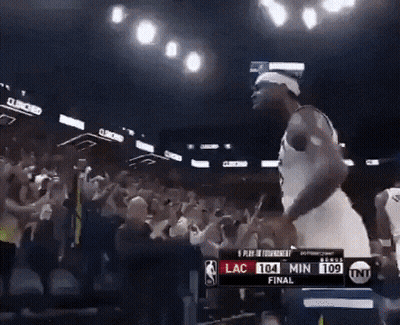 Basketball Player in Front of Scoreboard