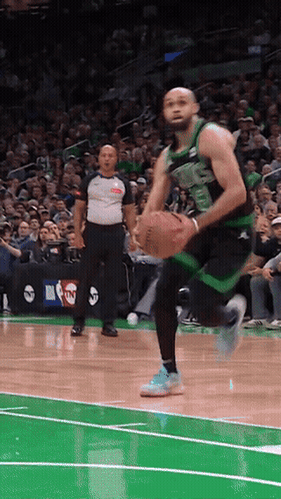 Basketball Player In Green And Black Uniform Number 23 GIF