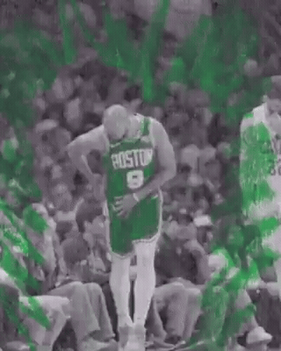 Basketball Player In Green Jersey In Front Of Crowd GIF