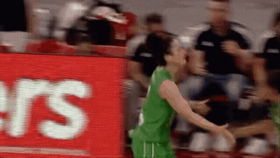 Basketball Player In Green Jersey In Front Of RS Sign GIF